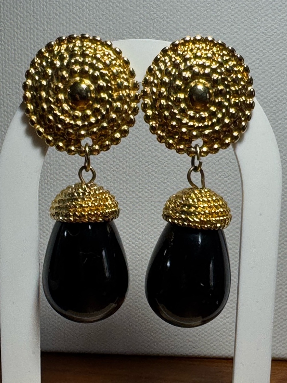 Blanca,  1980’s clip-on gold and black teardrop cabochons
